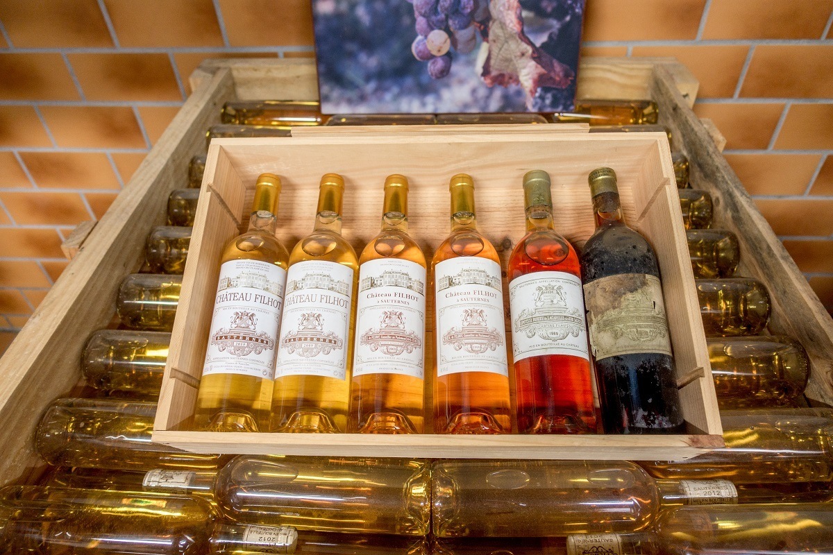 Bottles of different vintages of Chateau Filhot Sauternes on display
