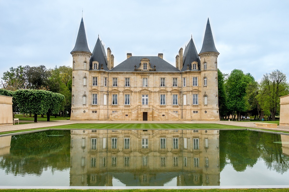 Castle-like building and reflecting pool at Chateau Pichon Baron
