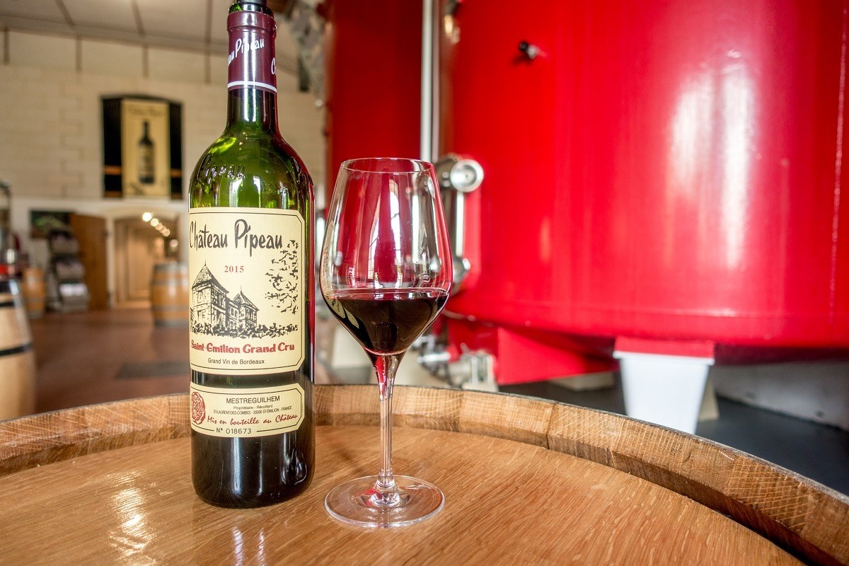 Saint-Emilion Grand Cru bottle and glass at Chateau Pipeau