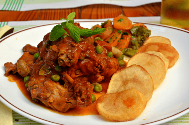 Stewed Maltese rabbit served with fired potatoes and vegetables