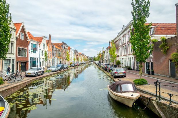 Boats in the Gouwe River in Gouda, Netherlands
