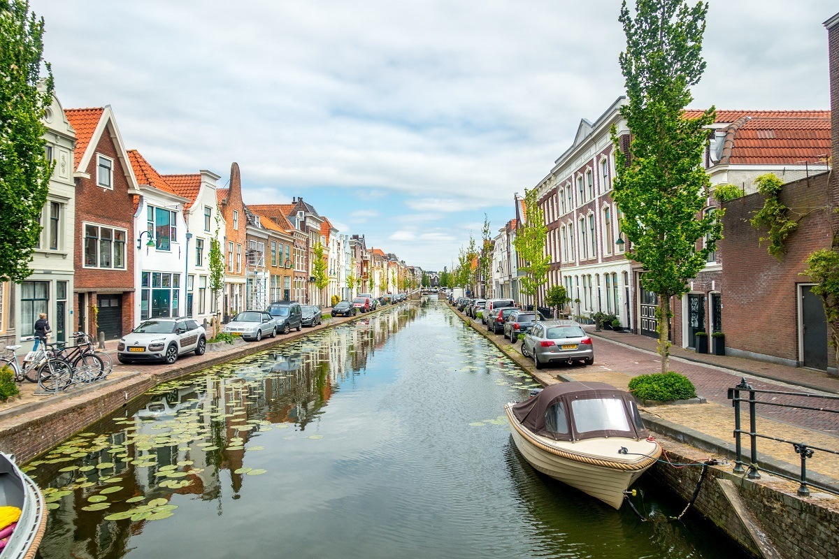 Boats in the Gouwe River in Gouda, Netherlands
