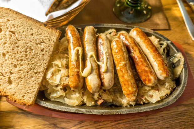 Small Nuremberger sausages are a must-try when you visit Nuremberg. They are traditionally served on a pewter plate with sauerkraut or potato salad.