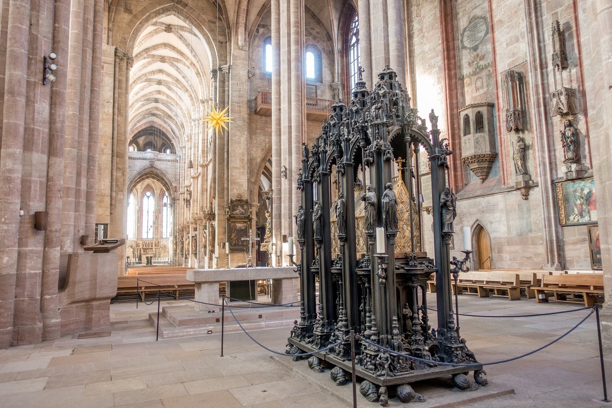 Church interior with ornate brass tomb of Sebaldus in the middle