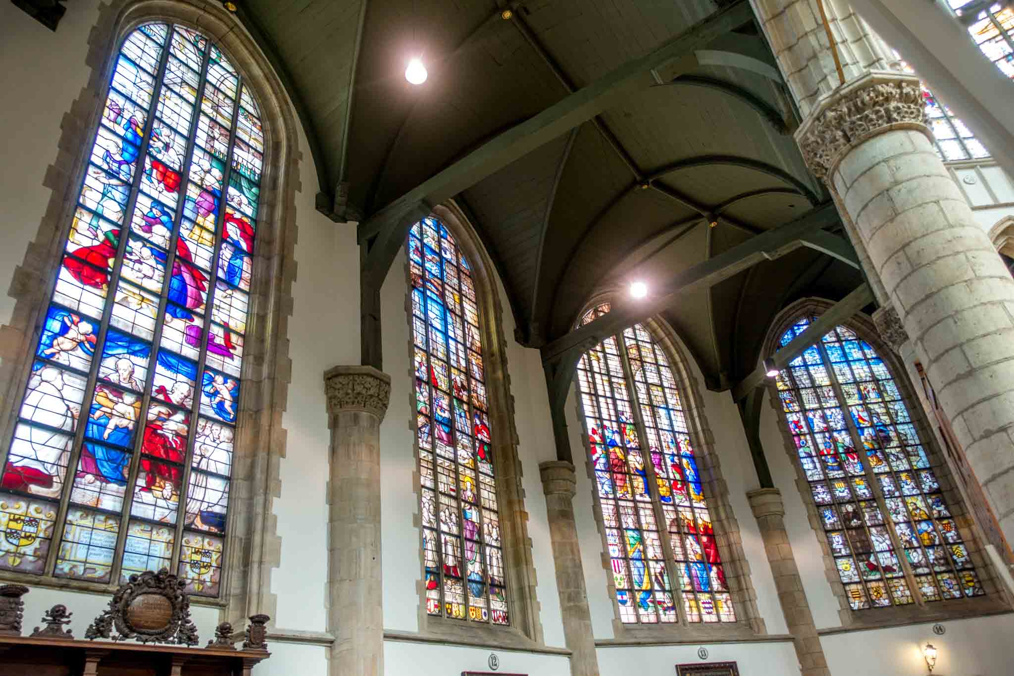 Church interior with bright stained glass in Gouda Netherlands