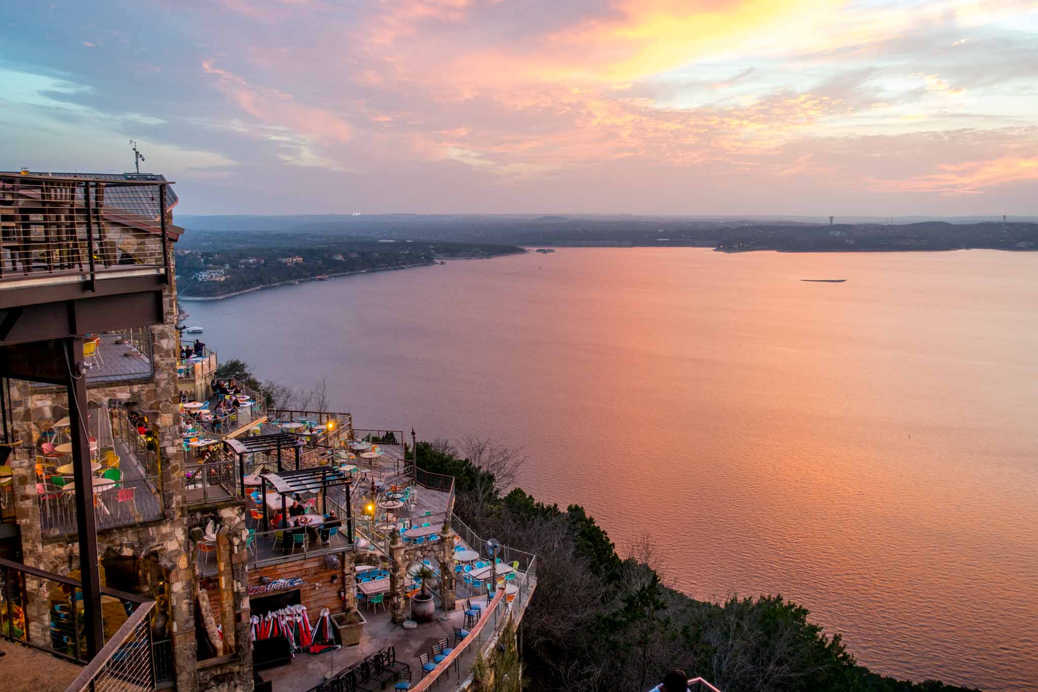 Seeing a brilliant sunset over Lake Travis at the Oasis is one of the best free things to do in Austin TX