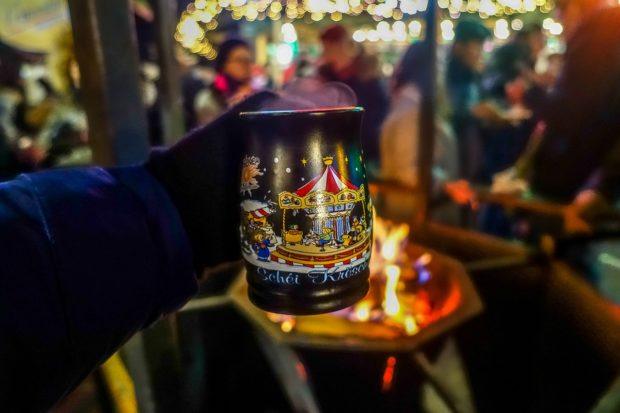 Mulled wine in a mug over an open fire