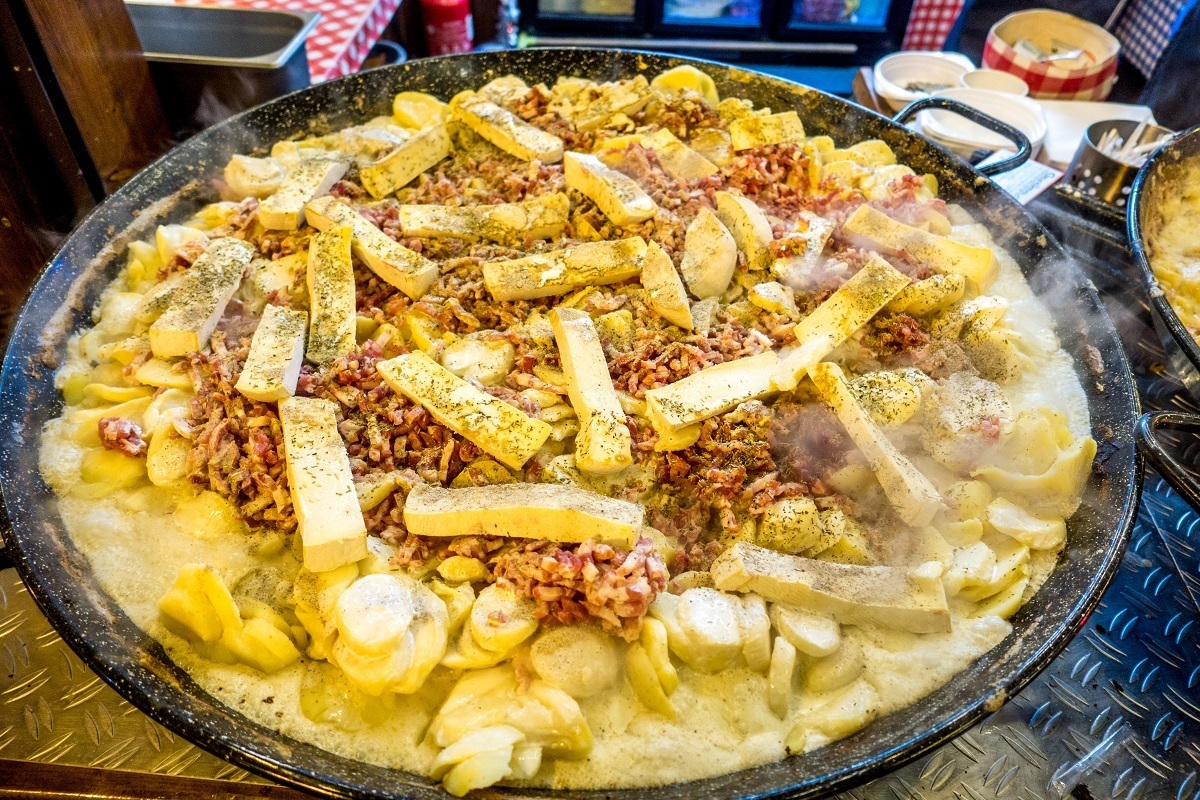Pan of tartiflette, a mix of potatoes, onions, lardons, cheese, and white wine