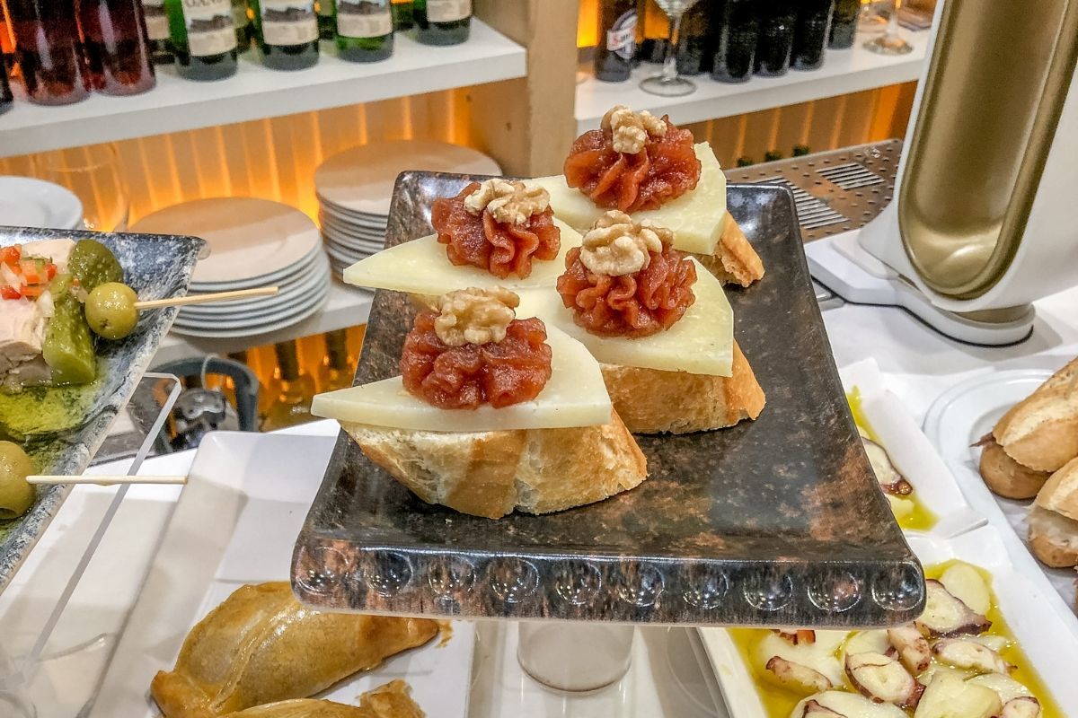 Idiazabal cheese served with quince paste and walnuts is one of the popular pintxos in the Basque Country (often erroneously called San Sebastian tapas)