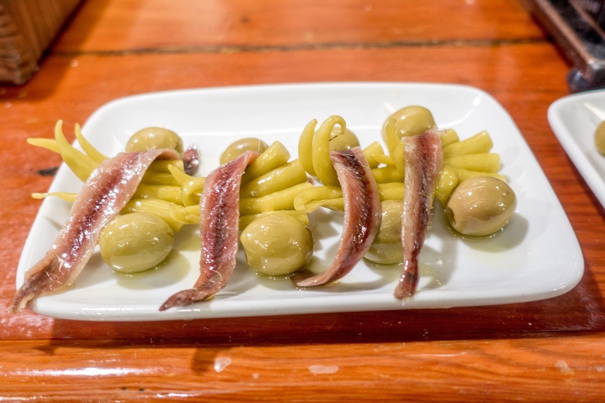 The Gilda pintxo--anchovy, pepper, and olive--is the city's most famous pintxo and is available at most San Sebastian pintxos bars