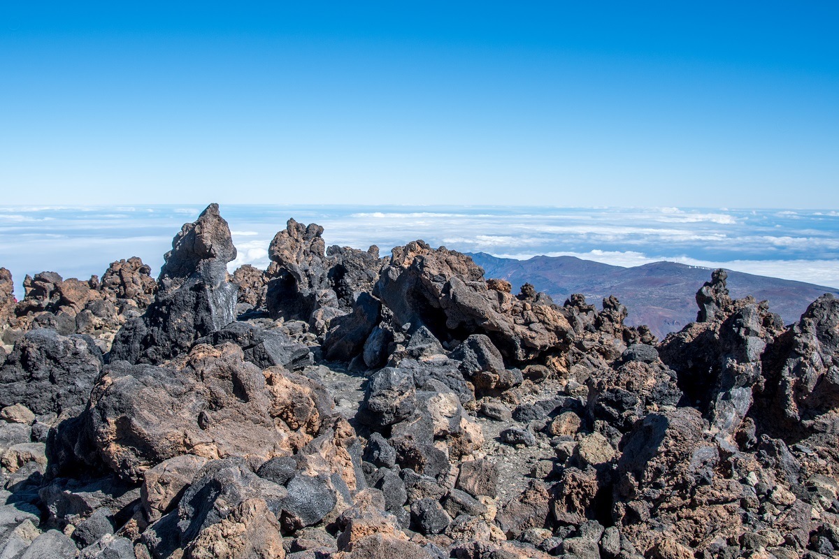 Hiking among the volcanic rocks on the way to the summit of Mt Teide.