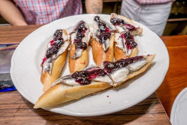 Anchovies topped with blueberry jam on a plate--not something you find at every pinchos bar in the Basque Country