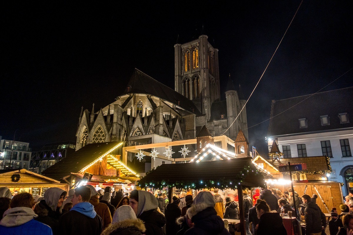 Christmas market stalls by St Nicholas Church in Gent, Belgium