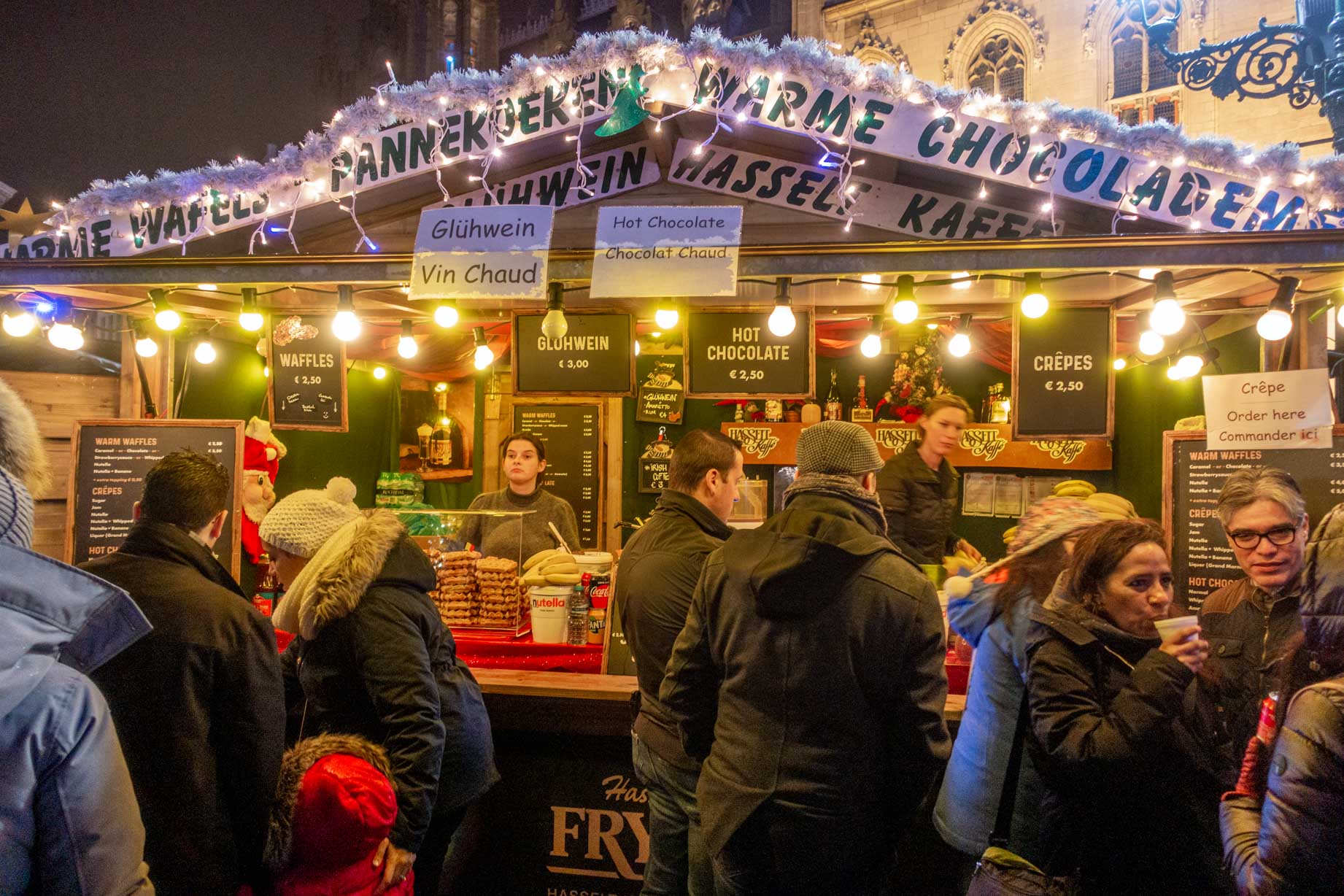 Shoppers lined up to buy drinks at the Christmas market in Bruges