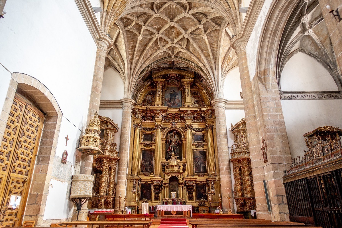 The golden altar and vaulted ceiling of San Miguel Church in Segovia, Spain
