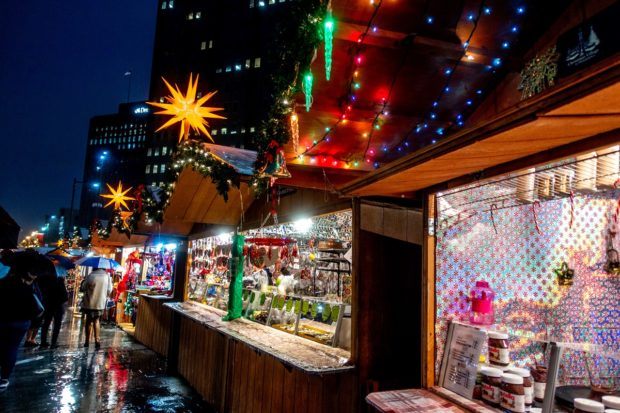Stands lit up at night at the Christmas Village, a traditional German Christmas market that's one of the best places to visit in Philadelphia PA at the holidays