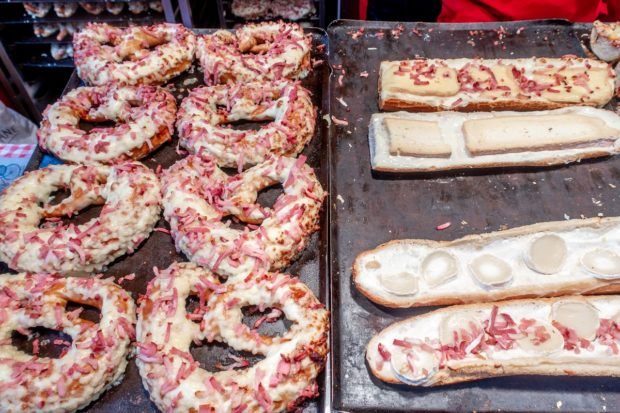 Bretzels and baguette flambée on display at the Christkindelsmärik Strasbourg in Place Broglie