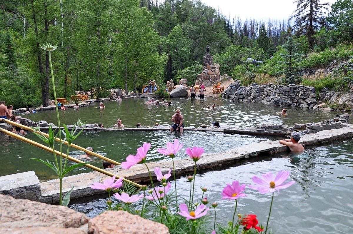 People in Strawberry Park, the best natural hot springs in Colorado.