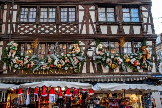 Stuffed animal decorations on the exterior of a half-timbered building in Strasbourg France at Christmas