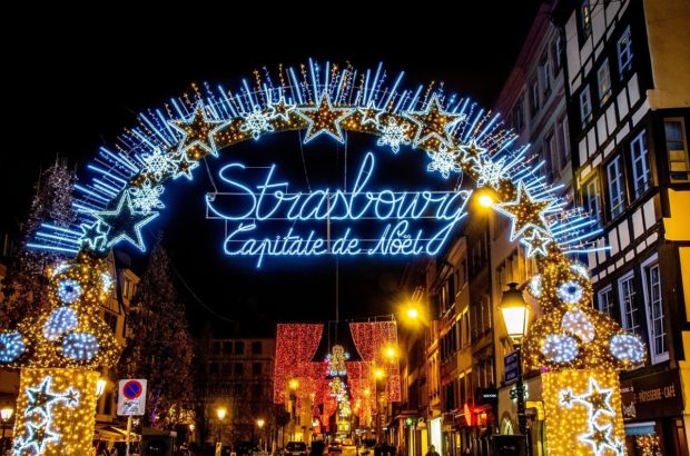 Seasonal Fun at the Strasbourg Christmas Market Colorful lights welcome visitors to the Strasbourg Christmas market in France, the Capitale de Noel