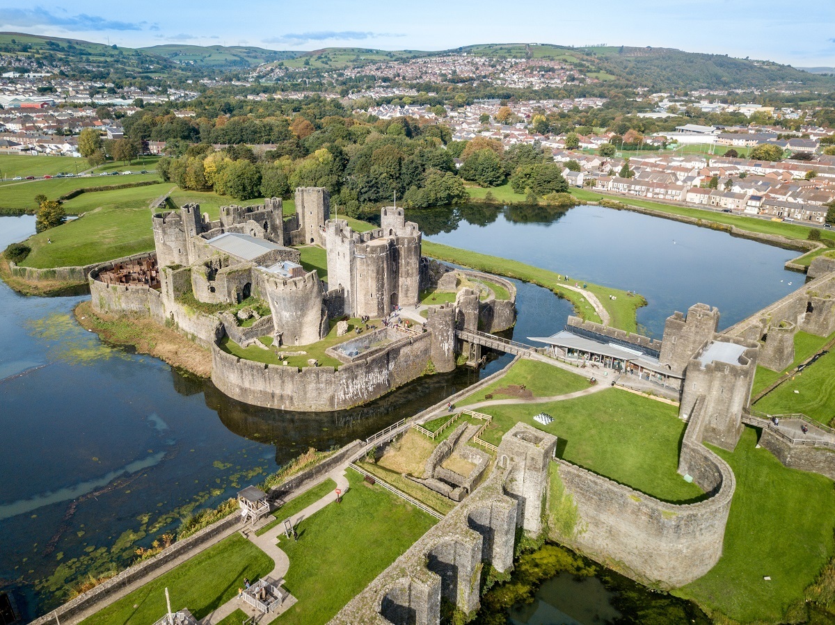 Aerial view of towers, bridge, and water defenses at Caerphilly Castle