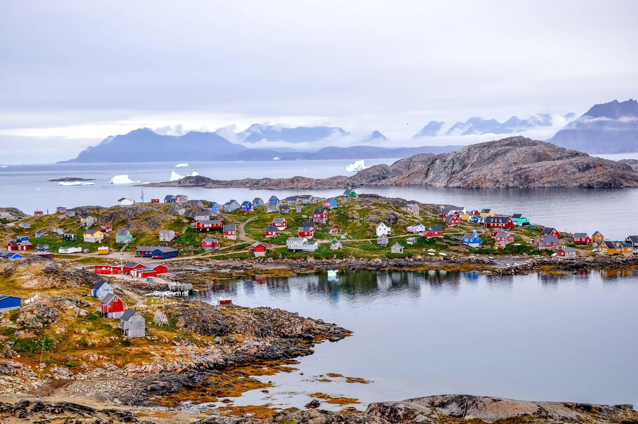 Harbor and colorful homes in Kulusuk, Greenland, a short flight from Iceland.