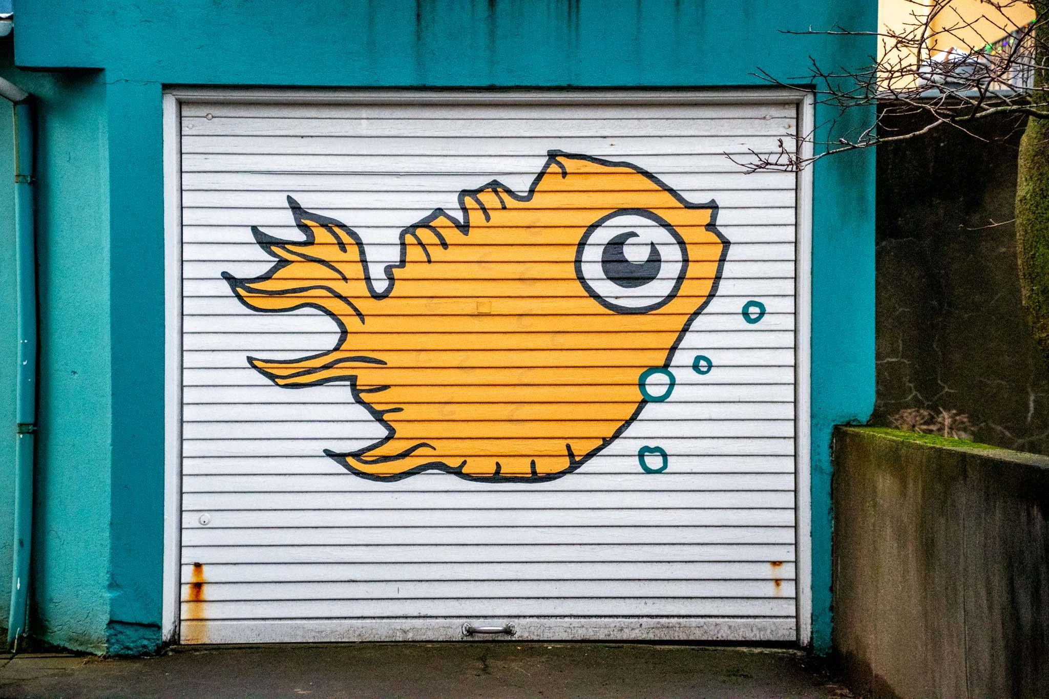 A fish mural in the shape of Iceland on a garage down in downtown Reykjavik.