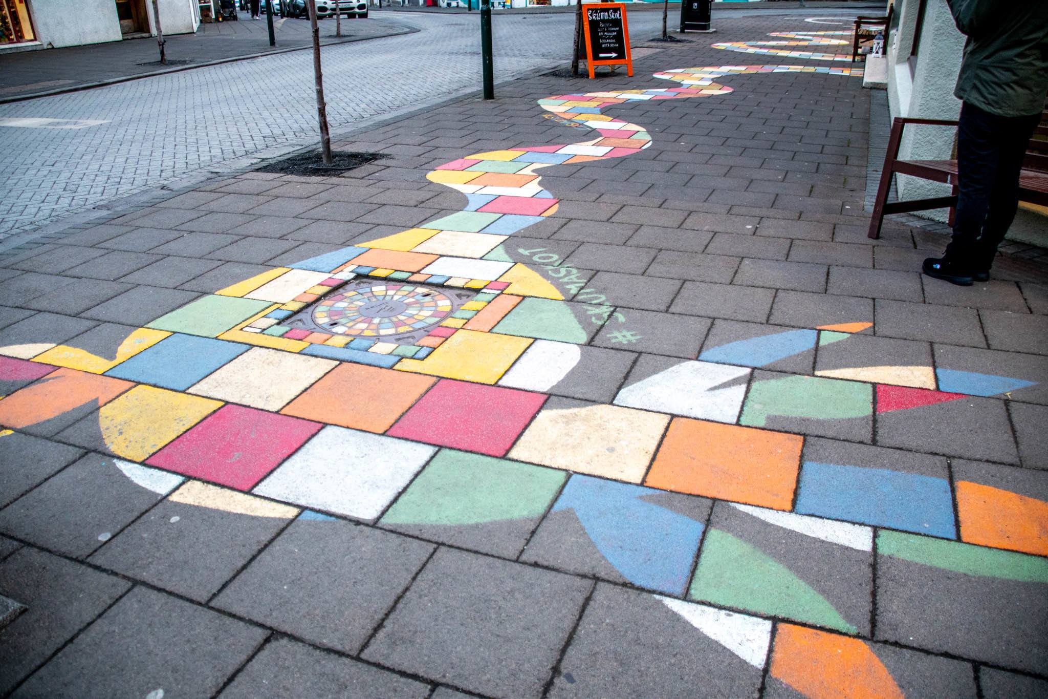 Iceland arts are both colorful and playful, as can be seen in this sidewalk art.