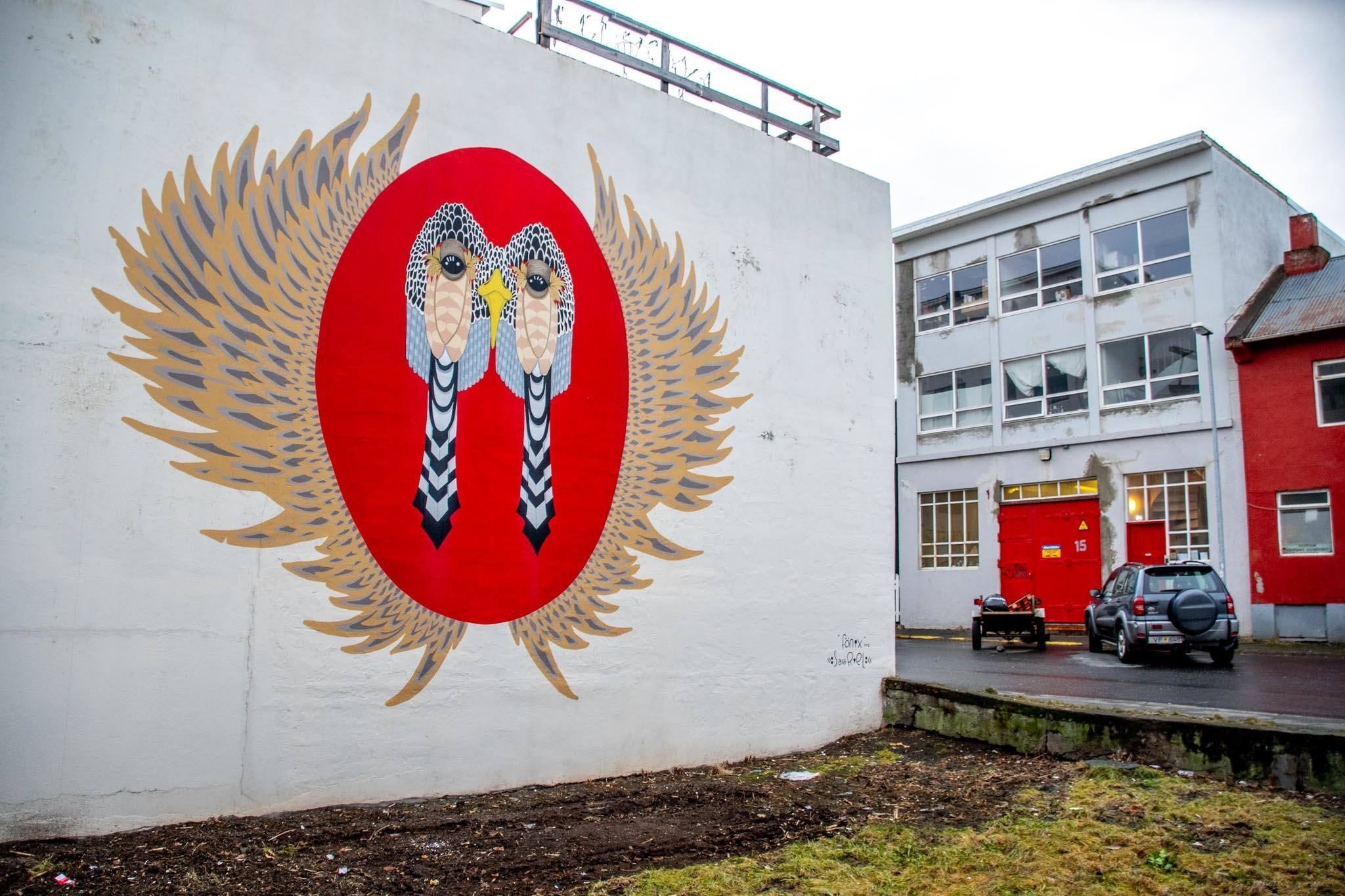 Commissioned wall murals, such as this one by muralist Sara Riel, are popping up in the city.