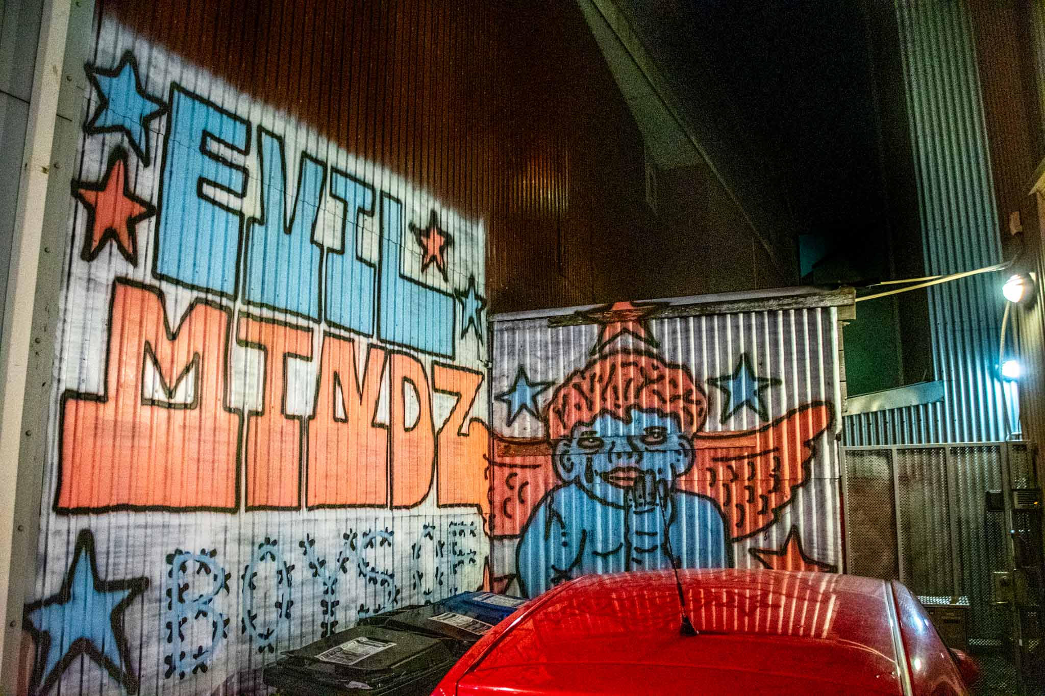 Evil Mindz mural in someone's driveway in Reykjavik.