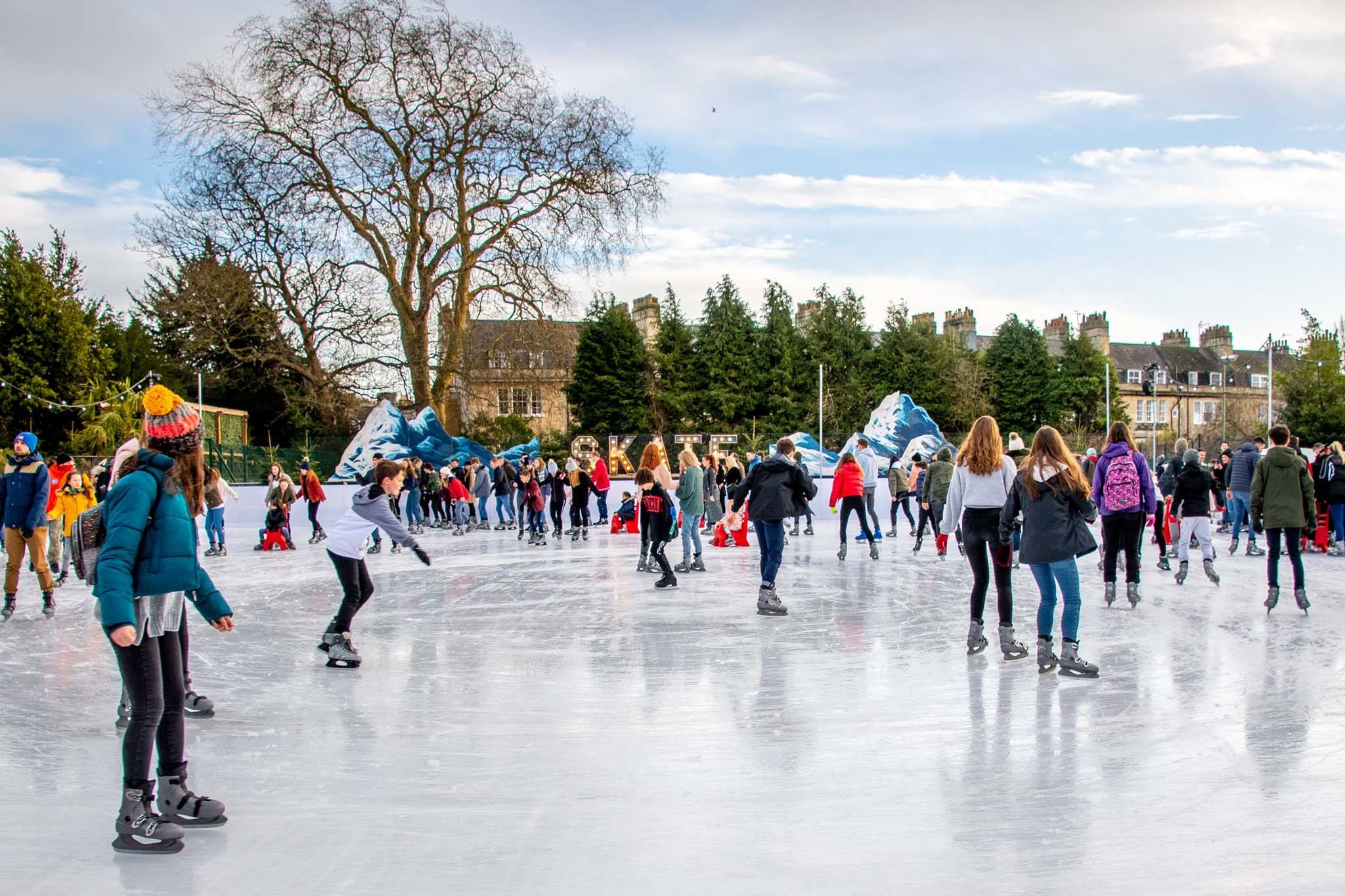 Skaters on ice-skating rink in Bath, England