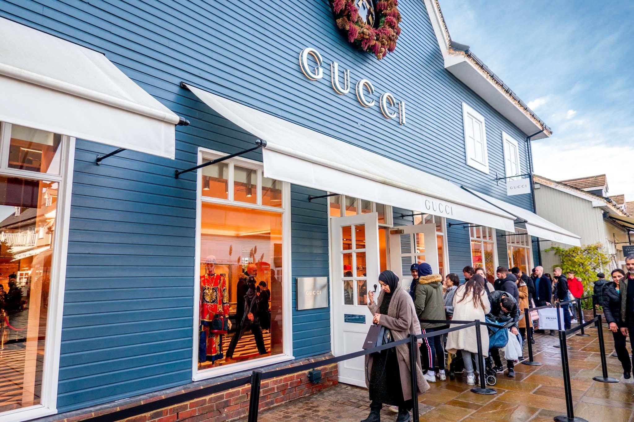 Line of people outside a Gucci store