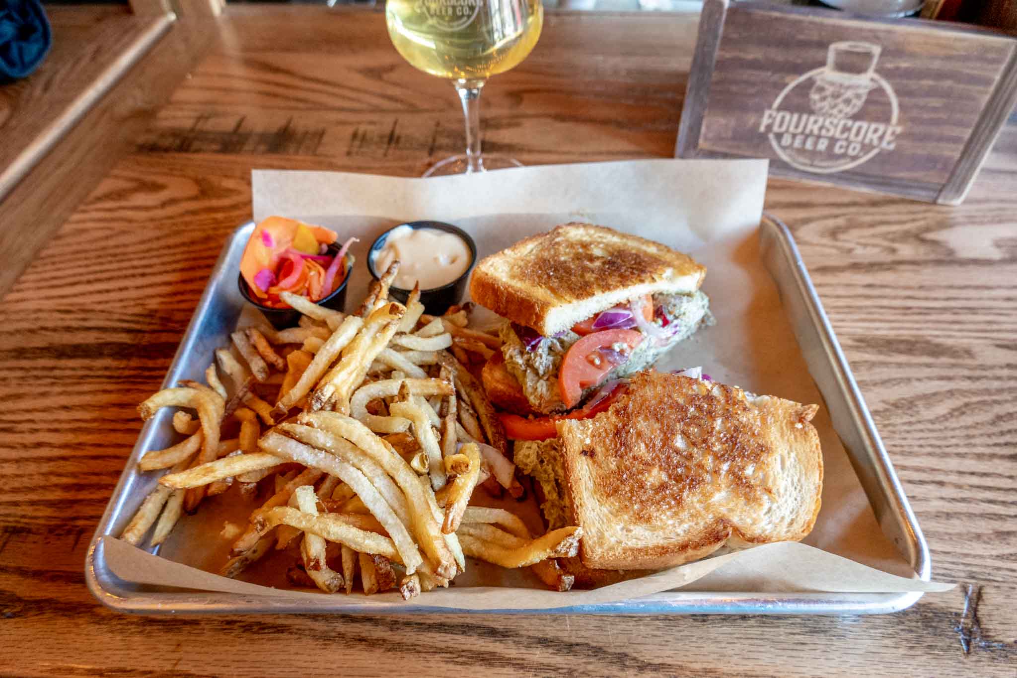 Sandwich and French fries on platter