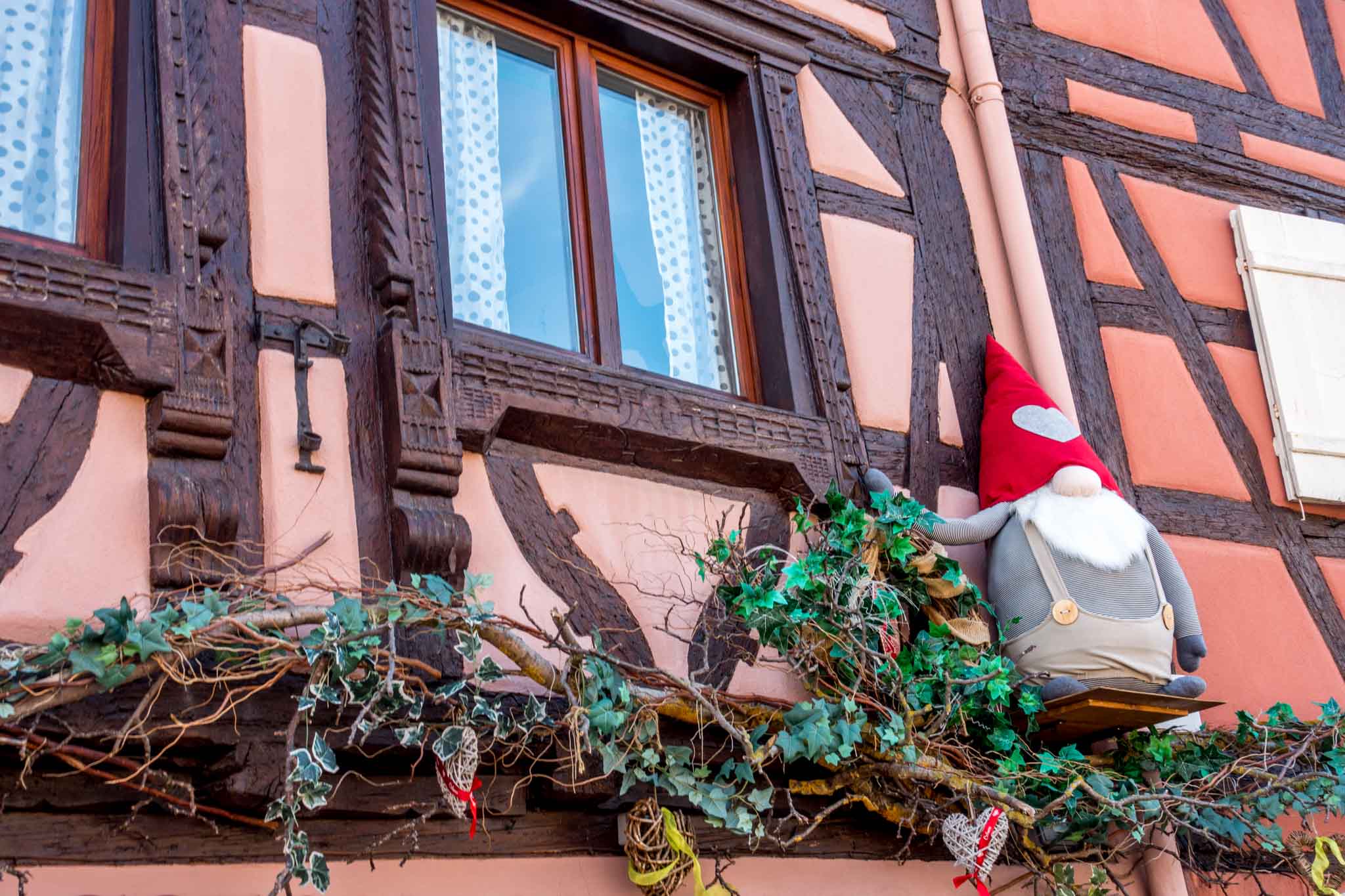 Stuffed gnome outside a building