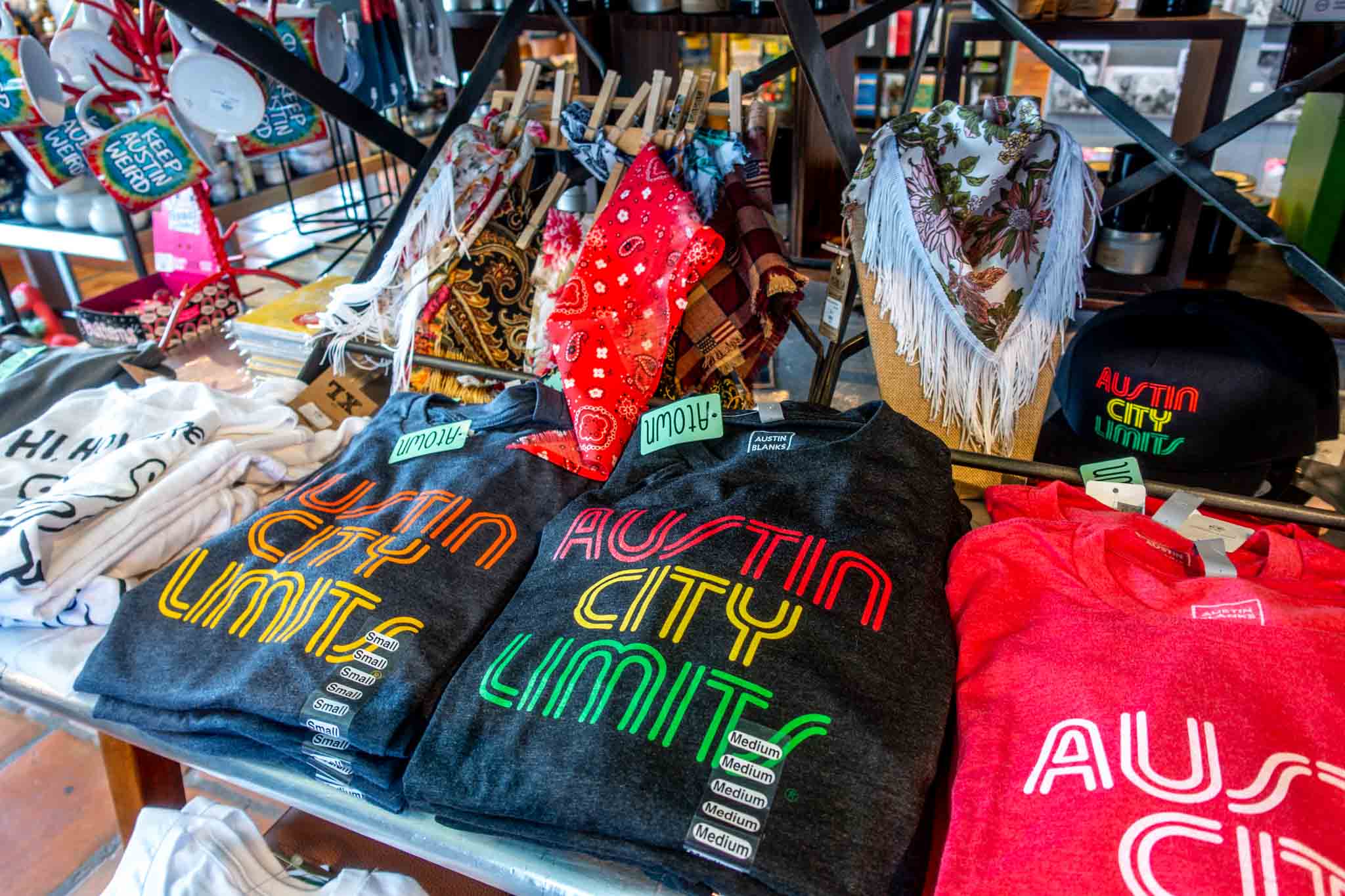 T-shirts and hats on display for sale