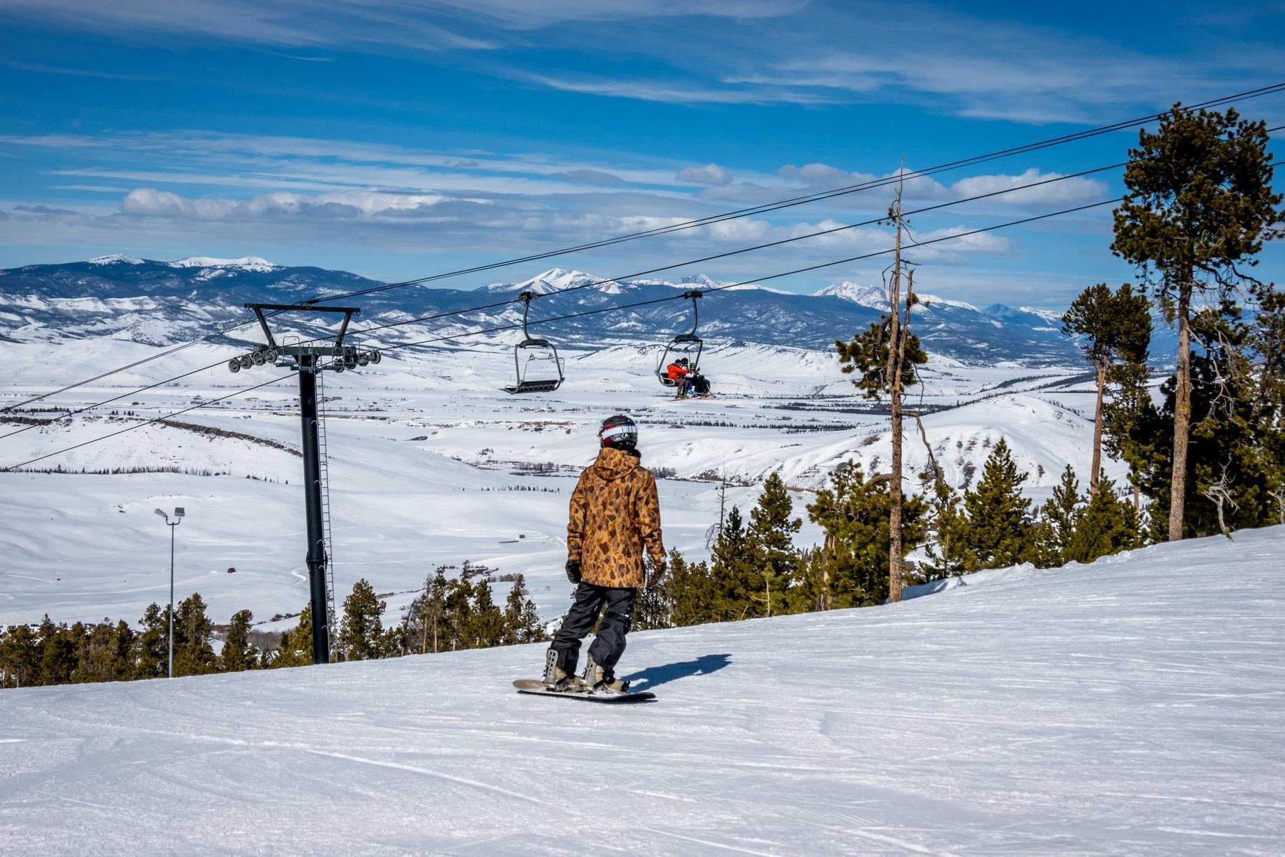 Snowboarder at Granby Mountain Ranch near ski lift